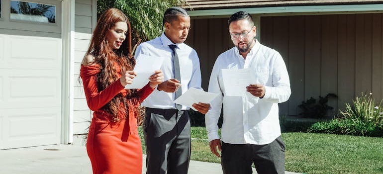 A real estate agent talking with clients about mountain and urban homes in Colorado
