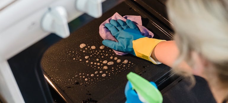 A person cleaning their new home after moving in