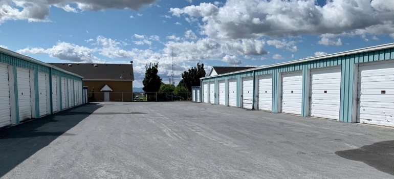 Rows of storage unit doors along a hallway at a self-storage facility