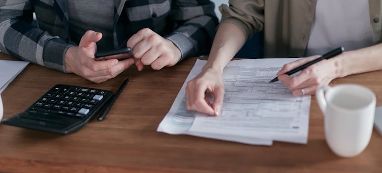 A person reviewing tax documents after a move to Colorado