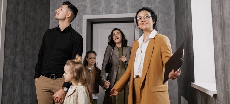 A real estate agent showing a rental home to clients
