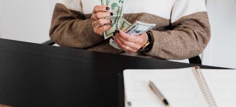 A person working on a household budget while following the Memphis housing market