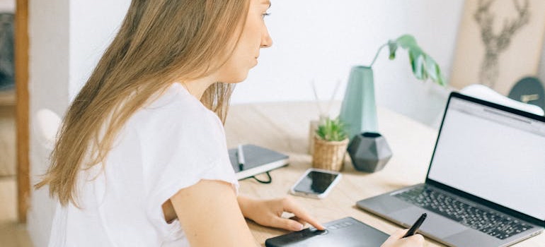 A person filling out a rental application on a computer
