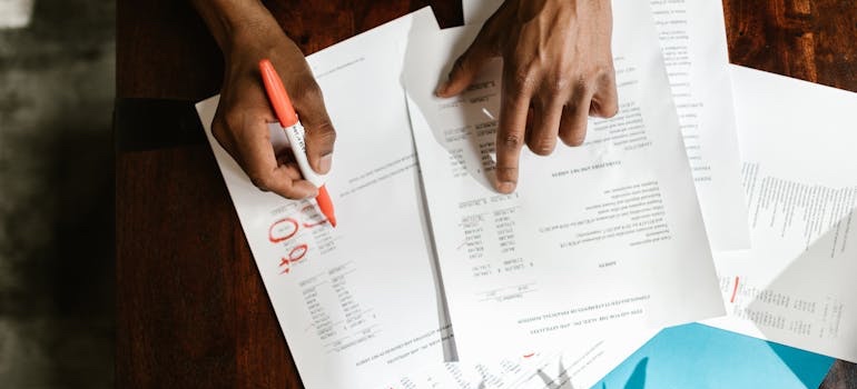 A person reviewing documents to navigate Denver's historic home regulations