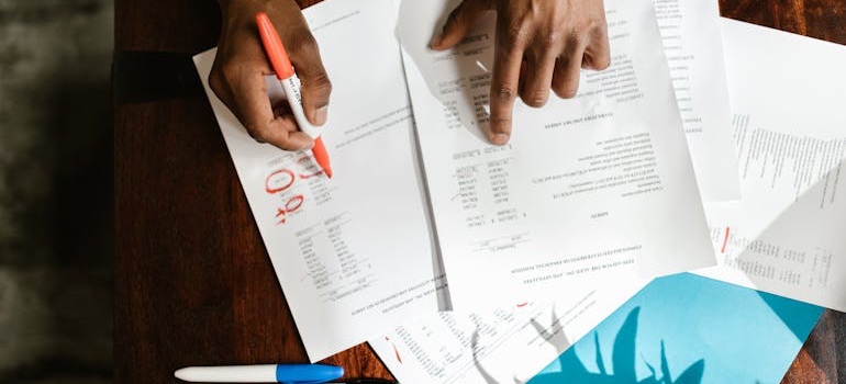 A person reviewing rental or mortgage documents