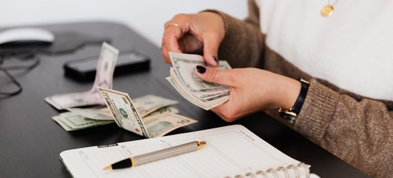 A person budgeting for a move to one of the affordable gem towns in Colorado