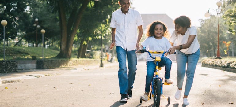 Parents at a park with their kid in one of the Mississippi towns you haven’t thought of