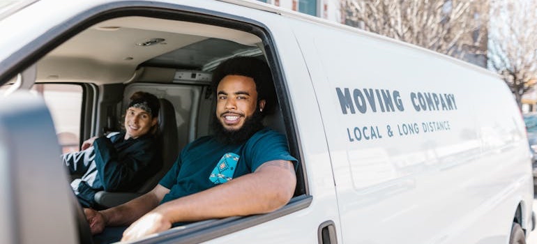 Movers driving a moving van