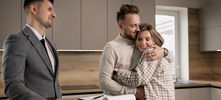 A real estate agent explaining to clients what to know about moving to a rural town in Mississippi