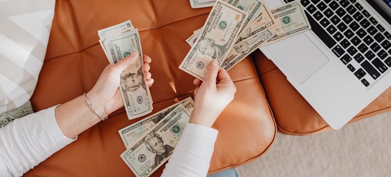 Person budgeting for a move to a more affordable Colorado city