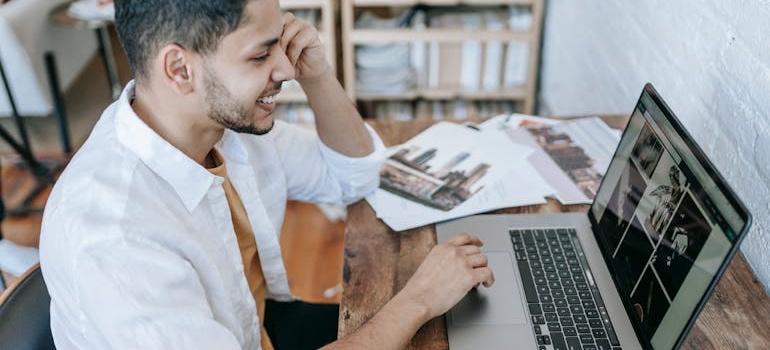 A person working from home on a laptop at a desk