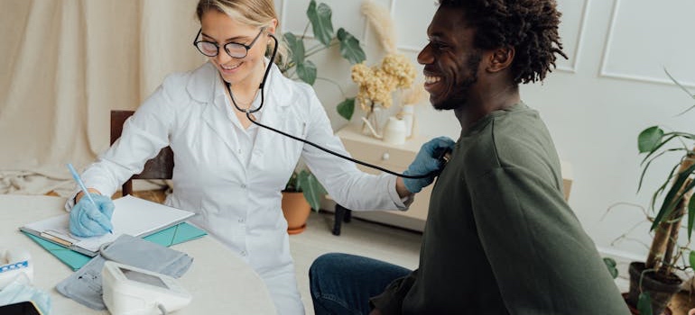 A doctor talking with a patient in a medical office