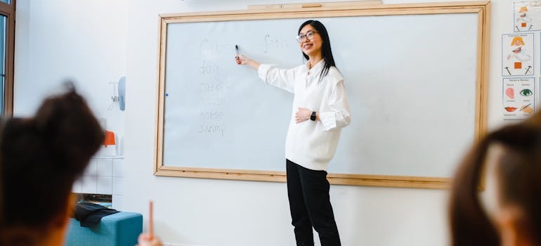 Young students in a classroom lesson with their teacher