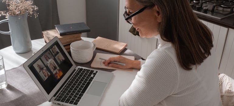 A person typing on a laptop at a desk