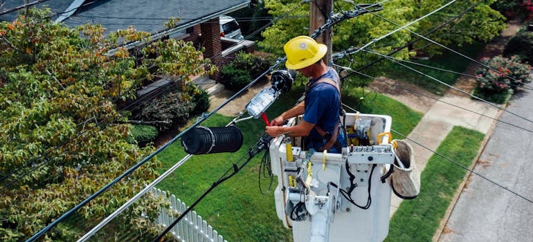 An electrician working on a home electrical panel