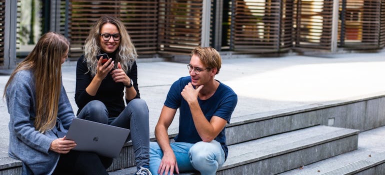 College students sitting on university steps