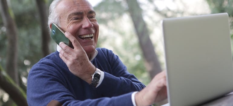 A senior woman using a laptop to review retirement and property tax rules