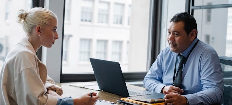 A person meeting a loan officer to apply for a mortgage