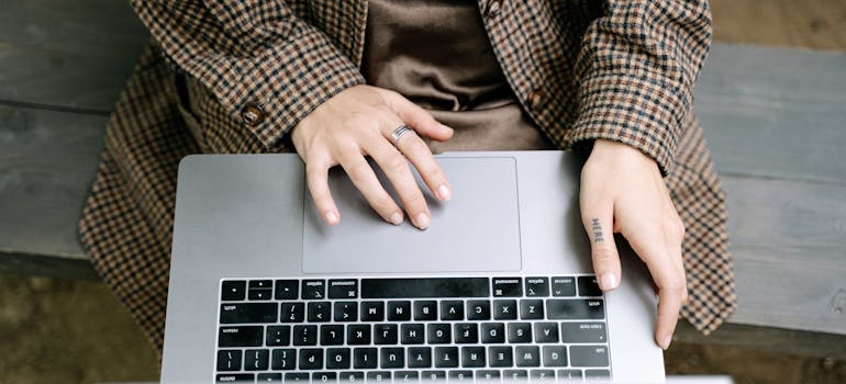Person researching Nashville suburbs on a laptop