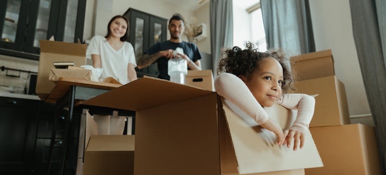 A family that knows the top reasons why people rent storage units packing for a move