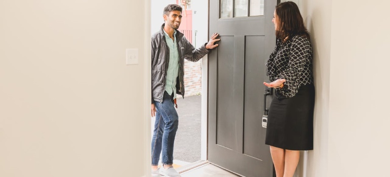 A real estate agent showing someone a home