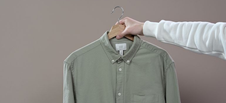 a person packing formal and business clothes