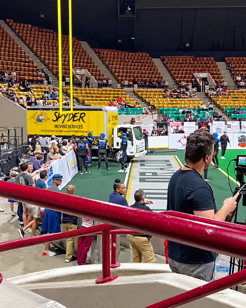 Spyder Moving and Storage truck on the field at a Colorado Spartans arena football game