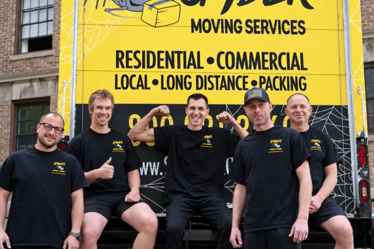 Spyder crew lined up in front of a Spyder moving truck
