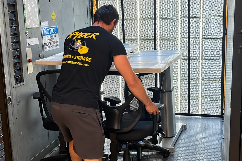 Spyder mover handling office chairs on a commercial move