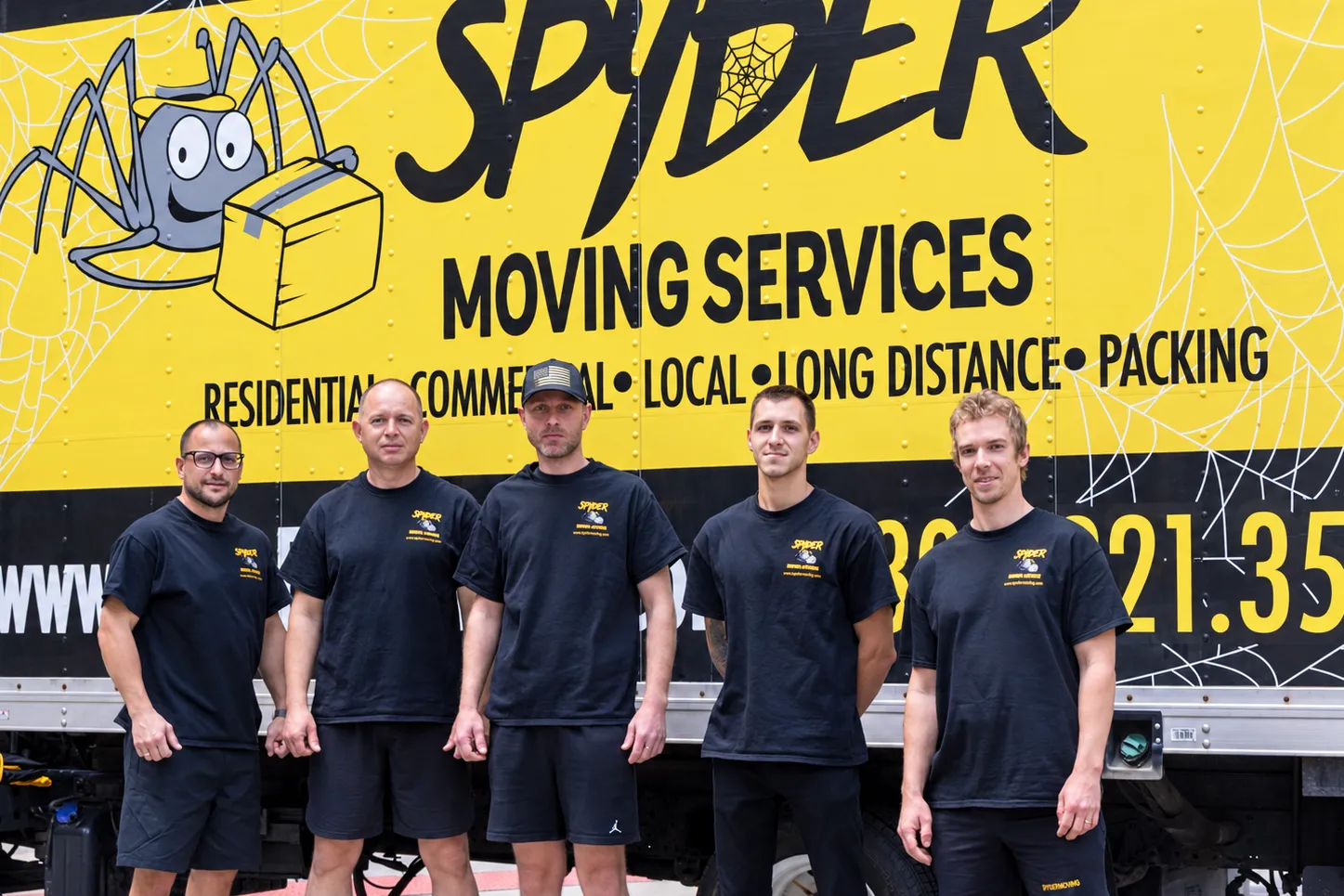 Five Spyder movers standing in front of a Spyder truck